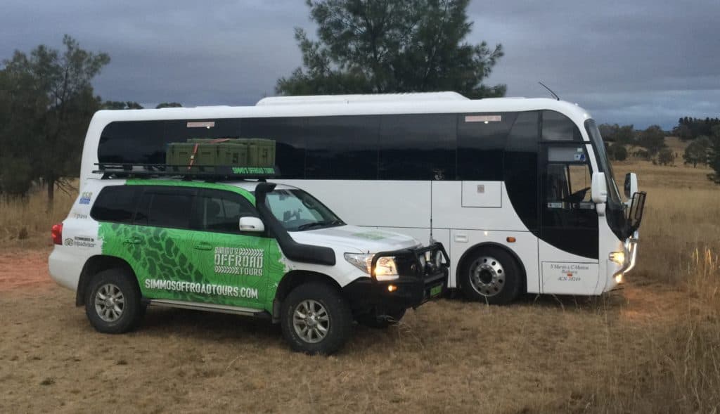 Image of a bus and a four wheel drive vehicle